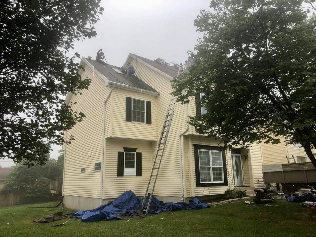 Installing new roof shingles